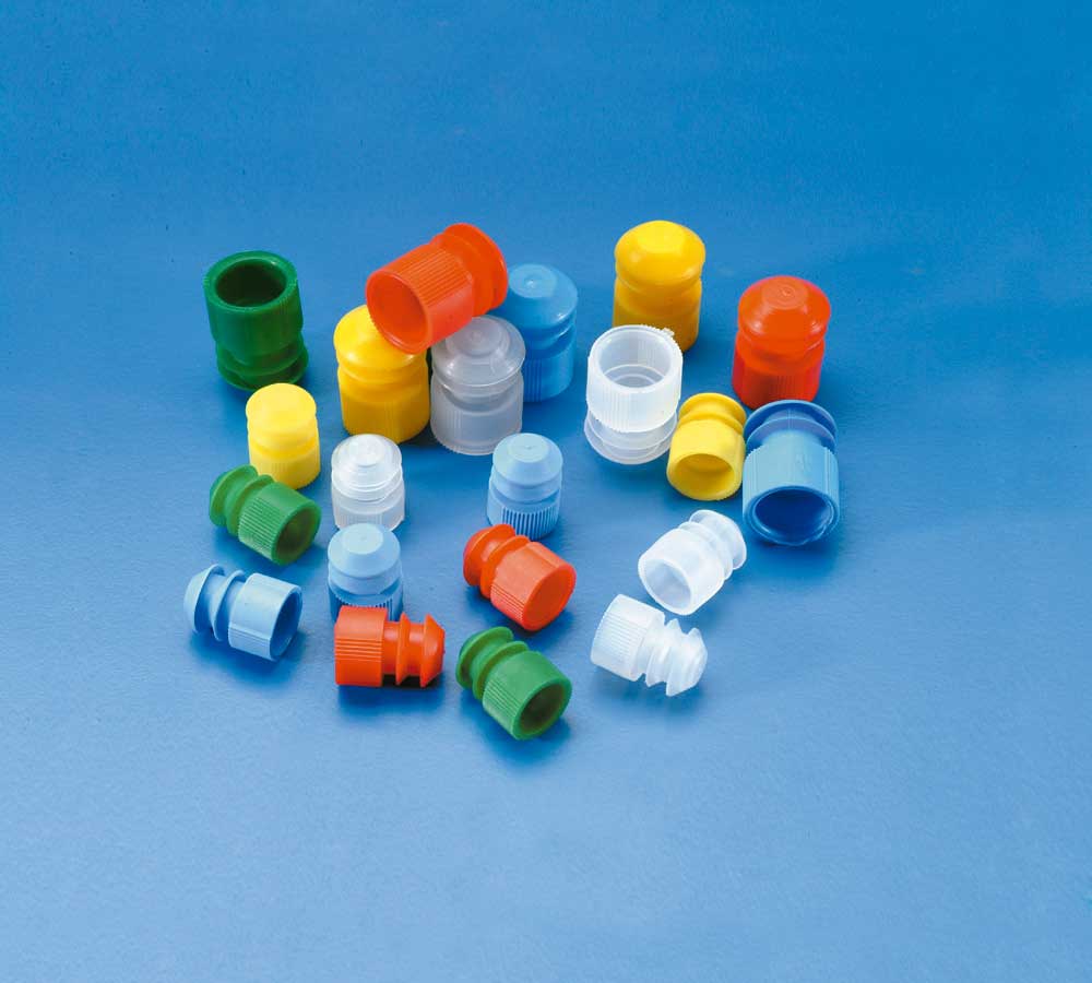Finned plugs for disposable tubes