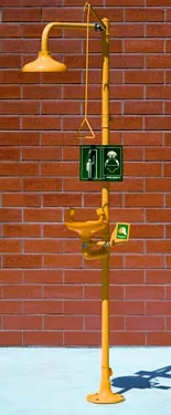 Safety equipment consisting of an emergency shower and eye wash station in yellow